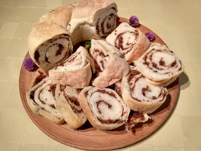 a plate with a bunch of pastries on it at Tourist Farm Strle With Great Local Food in Cerknica