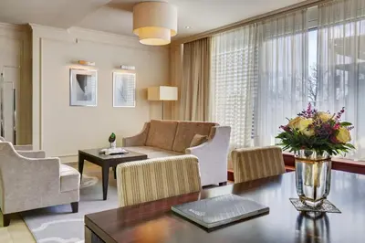 a living room with a couch and a table at Hotel Aleksander Medical & SPA in Rogaška Slatina