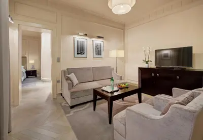 a living room with a couch and a table at Hotel Aleksander Medical & SPA in Rogaška Slatina