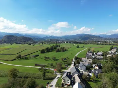 an aerial view of a small village with a road at Bled Home in Bled