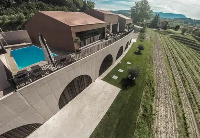 an overhead view of a house with a bridge at Fana Estate in Dobrovo