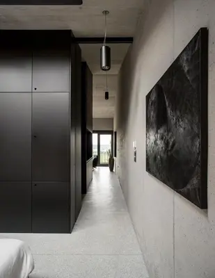 a hallway leading to a bedroom with a large painting on the wall at Fana Estate in Dobrovo