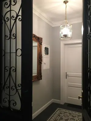 a hallway with a mirror and a door at FORUM Apartment I and II in Ljubljana