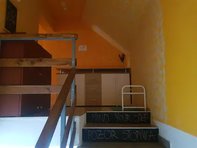 a staircase in a room with a bunk bed at Thirsty River Rooms in Bovec
