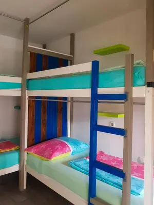 a bunk bed room with two bunk beds at Thirsty River Rooms in Bovec