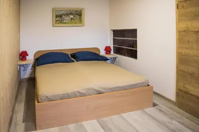 a bedroom with a bed in a room at Apartments Arh in Bohinjska Bistrica