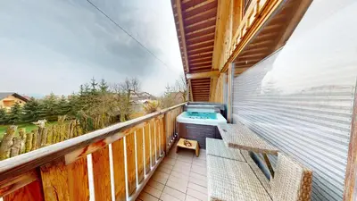 a balcony with a hot tub and a bench at Resort Hisa Ida - Apartments with Hot Tub and Sauna in Ivančna Gorica