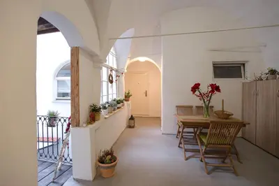 a hallway of a house with a table and chairs at Romantic Apartments Sweet Baci in Maribor
