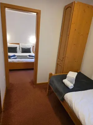 a mirror in a room with a bed at Hotel Rakov Skocjan in Cerknica