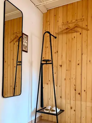 a mirror and a shelf in a room at Apartments Žnidar in Spodnje Gorje