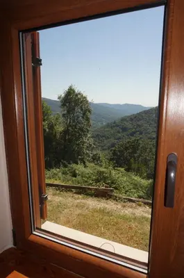 a window with a view of a mountain view at Valley View Apartment in Kambreško