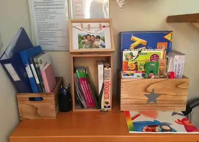 a desk with books and other items on it at Apartment Marjetica in Moravske Toplice