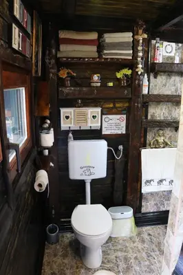 a small bathroom with a toilet in a house at Frenkcottage 5 KM FROM THE AIRPORT- FREE TRANSPORTATION TO THE AIRPORT in Šenčur