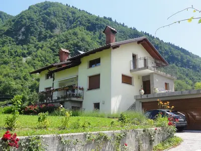 a house on the side of a mountain at Apartma Jezero in Most na Soči