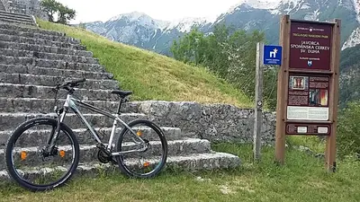 a bike is parked next to a sign at Apartma Jezero in Most na Soči