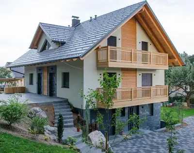 a house with a metal roof at Apartmaji Rajska Ptica in Bled