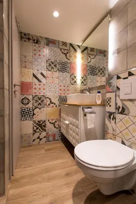 a bathroom with a toilet and a sink at Gami Ex-Factory Lofts in Ljubljana