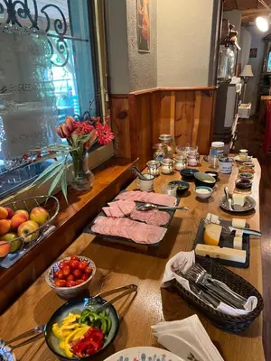 a long table with food on top of it at Apartments Kokl - Adults only in Radovljica