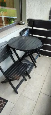 a picnic table and a bench on a patio at Planika B&M in Bohinj