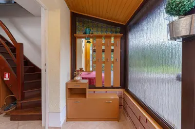 a room with a dresser and a mirror at Apartma Franko in Cerklje na Gorenjskem