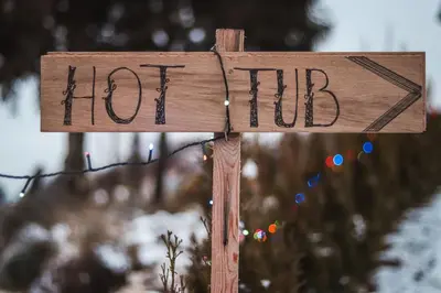 a wooden sign with the words hot tub at Panorama Glamping Visole in Slovenska Bistrica