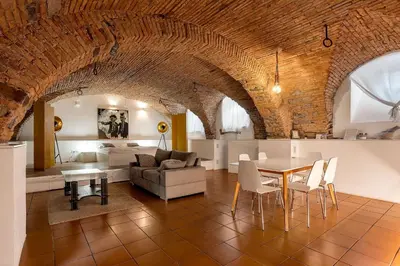 a living room with a couch and a table at Dungeon Apartment in Ljubljana
