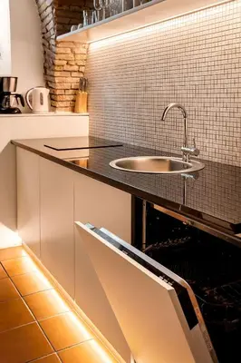 a kitchen with a sink and a counter at Dungeon Apartment in Ljubljana