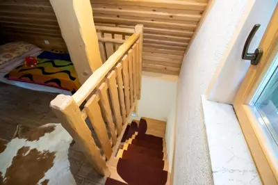 a staircase in a room with a bunk bed at Holiday Home Voje in Bohinj