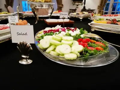a plate of vegetables on a table with a salad at Antiq Palace - Historic Hotels of Europe in Ljubljana
