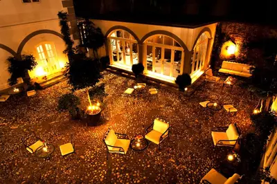 an aerial view of a courtyard with chairs and lights at Antiq Palace - Historic Hotels of Europe in Ljubljana