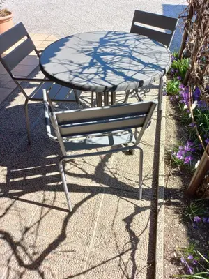 two chairs and a table and a table and chairs at Apartments Rozi in Bovec