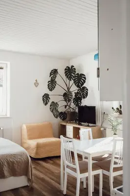 a bedroom with a table and chairs and a couch at Rural Carniola fairytale in Križe