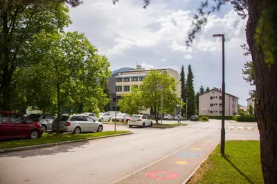 a street with cars parked on the side of the road at Hotel Prebold in Prebold