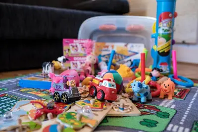 a table topped with toy vehicles and other toys at Apartma Marjetica 2 in Moravske Toplice