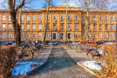 a group of bikes parked in front of a building at Tržaška Duplex Urban Apartment in Ljubljana