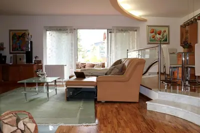 a living room with a couch and a table at Cosy apartment in Kranjska Gora