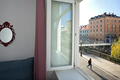 a window with a view of a city at Tromostovje apartments in Ljubljana