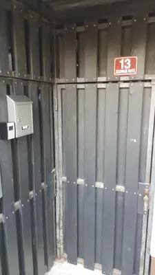 a wall of a building with a sign on it at Apartment HM in Gozd Martuljek
