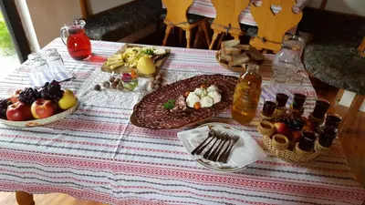 a table with plates of food on top at Farm stay Majdač in Solčava