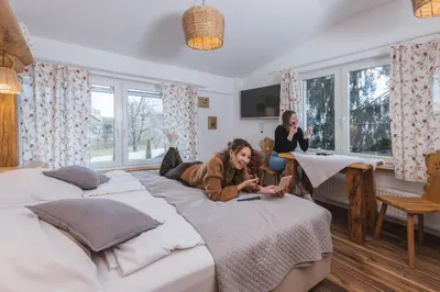 a woman laying on a bed in a bedroom at Central Bled House in Bled