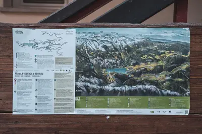 a sign hanging on a wall with a mountain at Učni ranč Bohinj, Boutique Horse-Friendly Retreat in Bohinj
