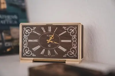 a clock sitting on top of a table at Učni ranč Bohinj, Boutique Horse-Friendly Retreat in Bohinj