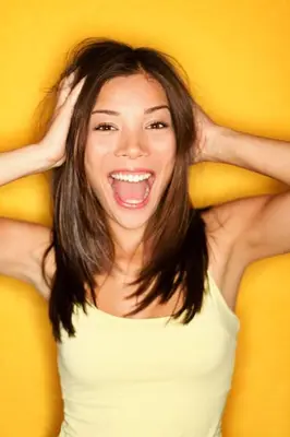 a woman smiling with her hands on her head at Hotel Cateski Dvorec in Čatež ob Savi