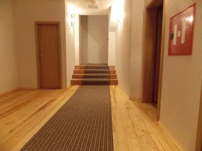 an empty hallway with stairs and a hallway sidx sidx at Guesthouse Stari Tišler in Ljubljana