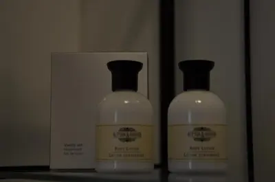 two bottles of laundry detergent sitting next to a box at Guesthouse Stari Tišler in Ljubljana