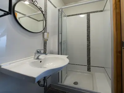 a bathroom with a sink and a shower at Guesthouse Stari Tišler in Ljubljana