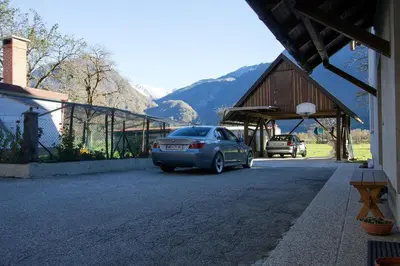 a car parked in the driveway of a house at Apartment Mavrica in Bovec