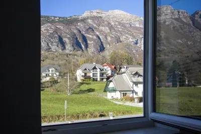a window with a view of a mountain at Apartment Mavrica in Bovec