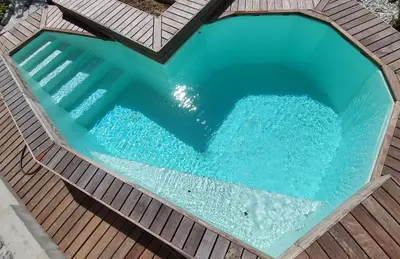 an overhead view of a swimming pool on a wooden deck at Čebelja Zibka in Ljubljana
