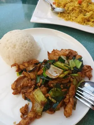 a white plate of food with rice and meat at Bed&Breakfast Zilje in Vinica